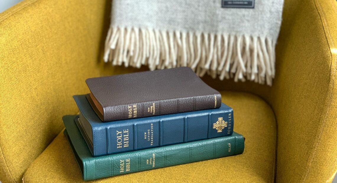 black and green books on yellow textile