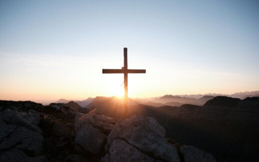brown cross on brown rock during daytime