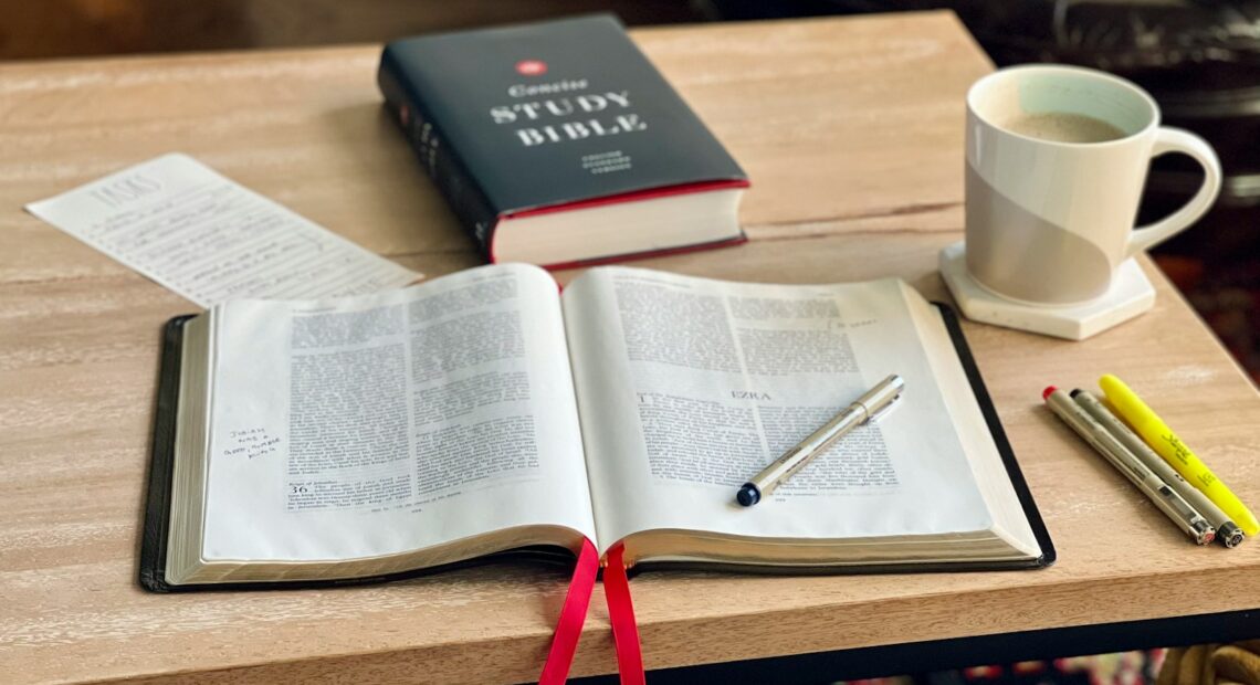 a book and a cup of coffee on a table