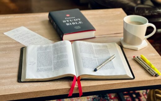 a book and a cup of coffee on a table