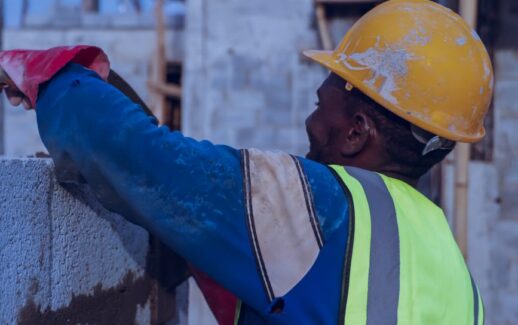 construction worker building a concrete wall